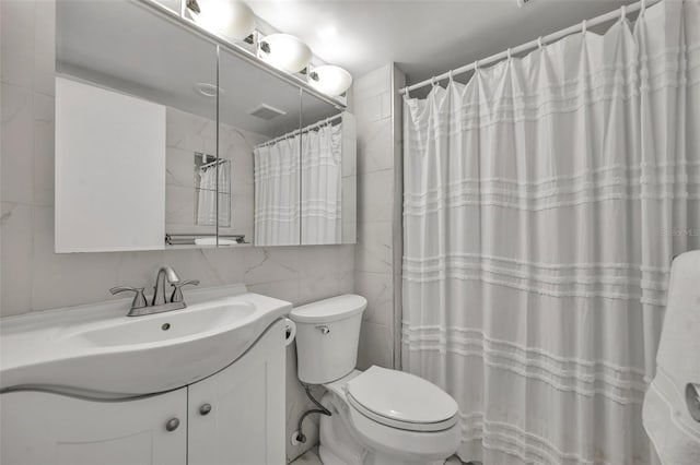 bathroom with curtained shower, backsplash, toilet, vanity, and tile walls