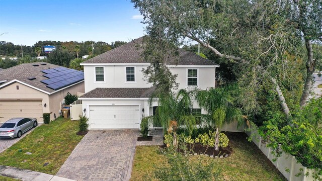 view of front of house featuring a garage and a front yard