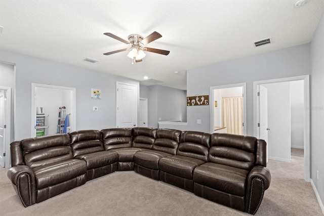 carpeted living room featuring ceiling fan