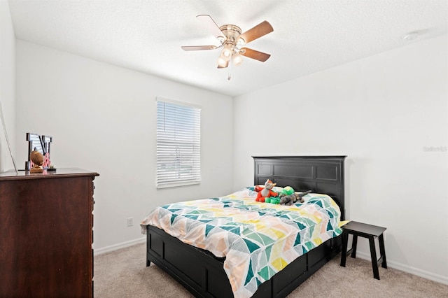 bedroom featuring ceiling fan and light colored carpet