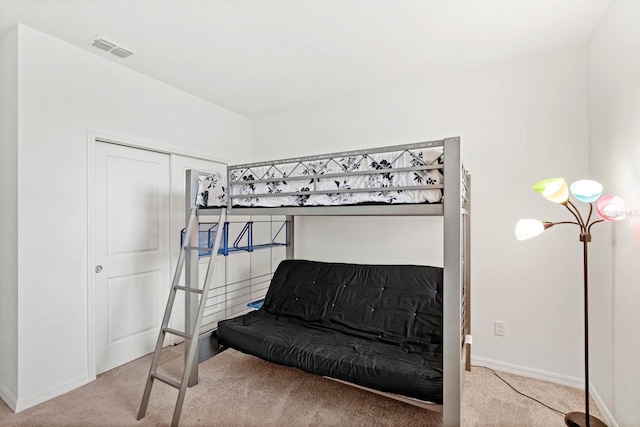 bedroom featuring light colored carpet