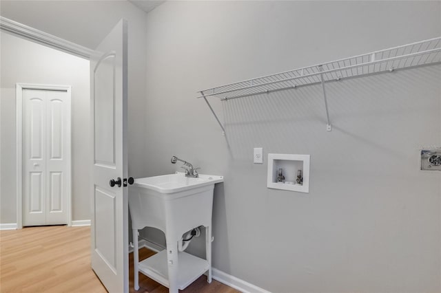 washroom with washer hookup, wood-type flooring, and hookup for an electric dryer