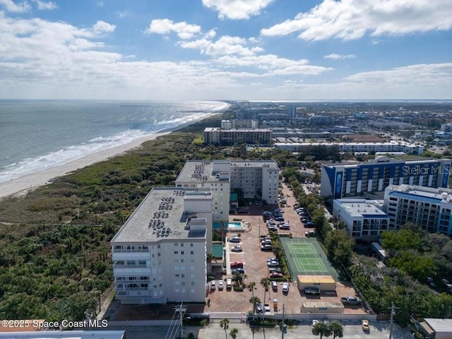 birds eye view of property featuring a water view and a view of the beach