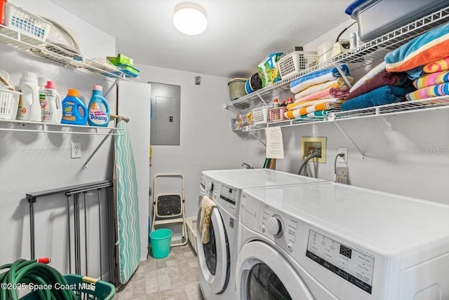 washroom featuring separate washer and dryer and electric panel