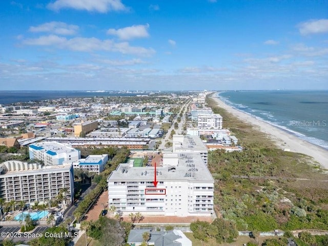 aerial view featuring a view of the beach and a water view