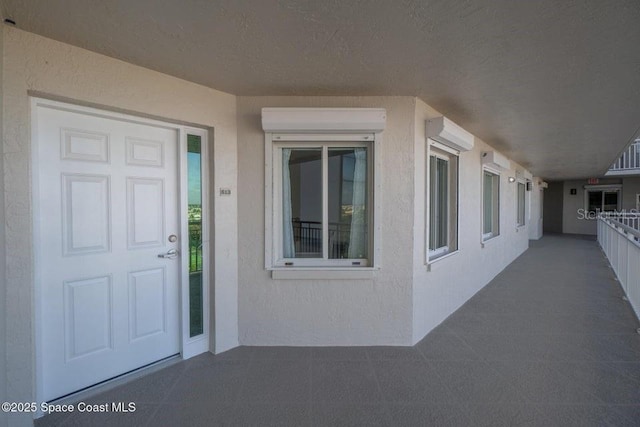 property entrance featuring a wall unit AC