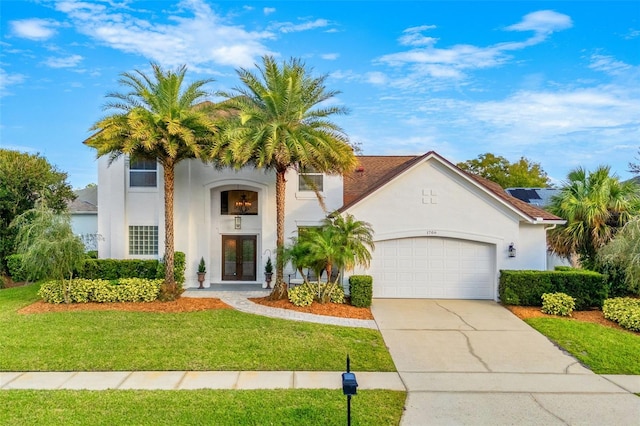 view of front of home with a garage and a front yard