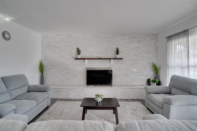 living room with a stone fireplace