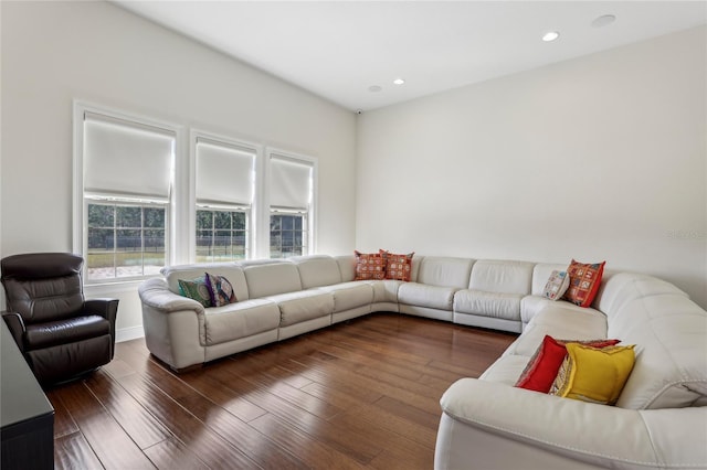 living room featuring dark wood-style flooring and recessed lighting