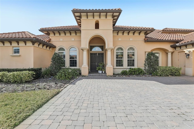 mediterranean / spanish house with stucco siding