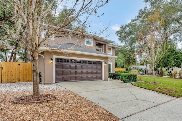 view of front of home with a front yard and a garage