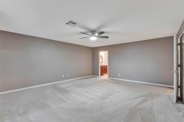 unfurnished room featuring light colored carpet and ceiling fan