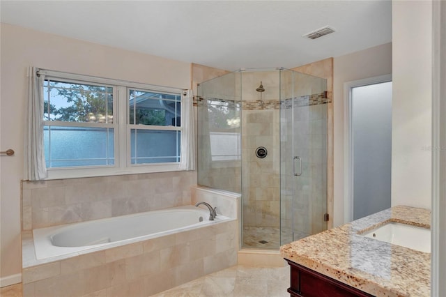 bathroom with independent shower and bath and vanity