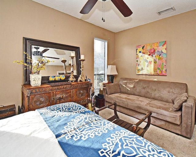 bedroom with ceiling fan and carpet flooring