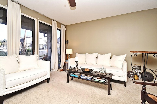 living room featuring ceiling fan and carpet flooring