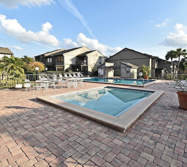 view of swimming pool with a patio