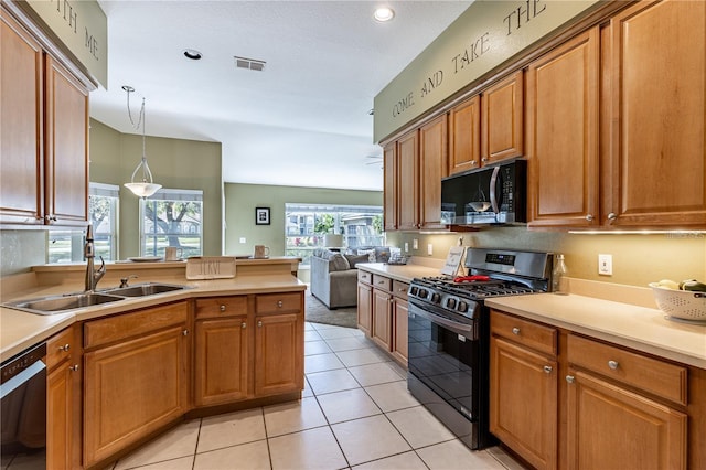 kitchen with gas stove, sink, decorative light fixtures, dishwasher, and light tile patterned flooring