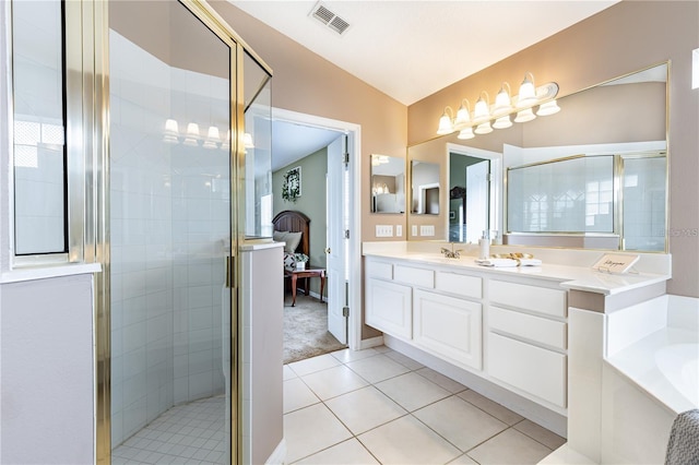 bathroom featuring tile patterned floors, vanity, shower with separate bathtub, and vaulted ceiling