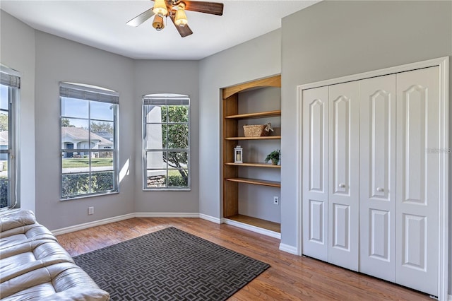 sitting room featuring light hardwood / wood-style floors and ceiling fan