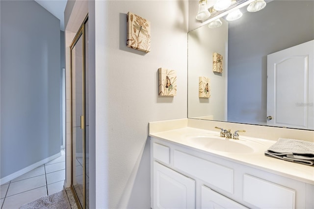 bathroom with tile patterned flooring and vanity