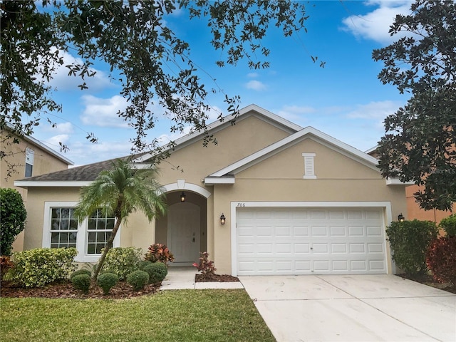 single story home with a front lawn and a garage