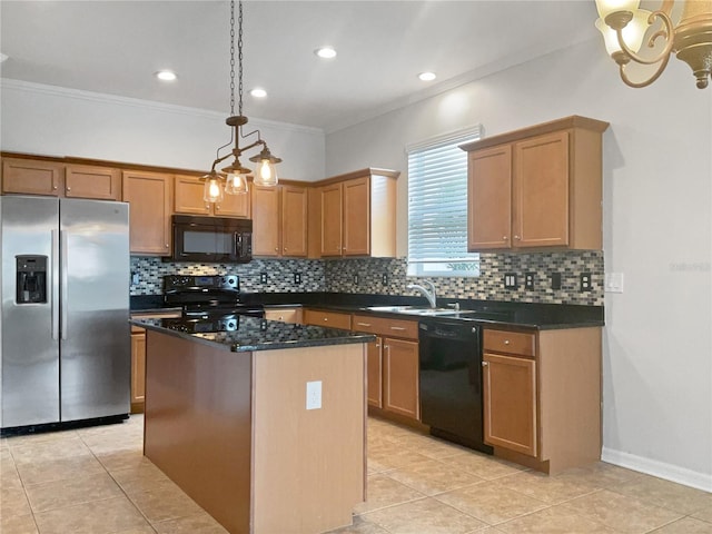 kitchen featuring sink, a center island, hanging light fixtures, black appliances, and crown molding