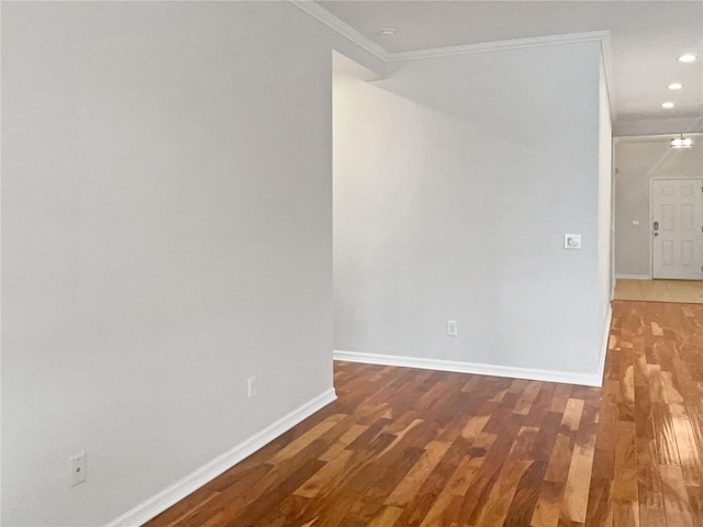 spare room with hardwood / wood-style flooring and ornamental molding