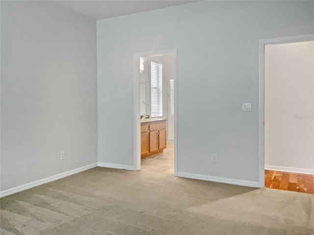 empty room featuring light carpet