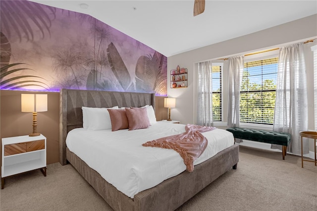 bedroom with ceiling fan and light colored carpet