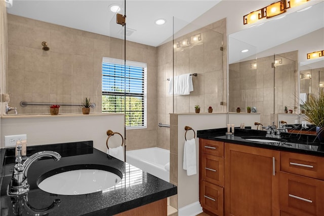 bathroom with vanity, separate shower and tub, and lofted ceiling