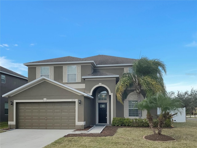 view of front facade with a front lawn and a garage