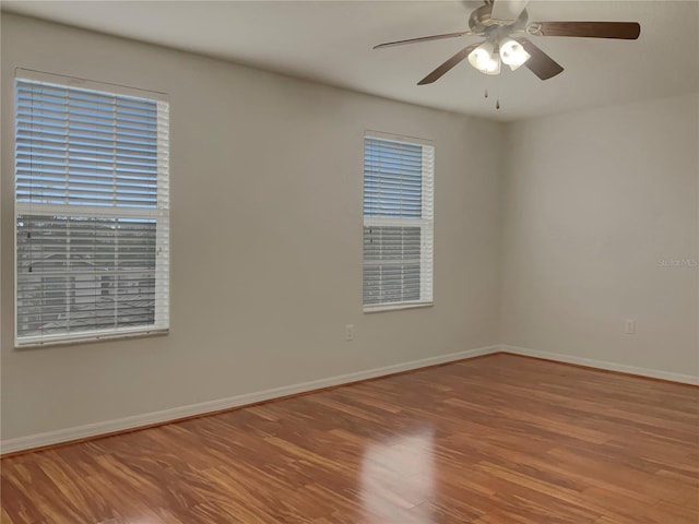 spare room featuring ceiling fan and wood-type flooring