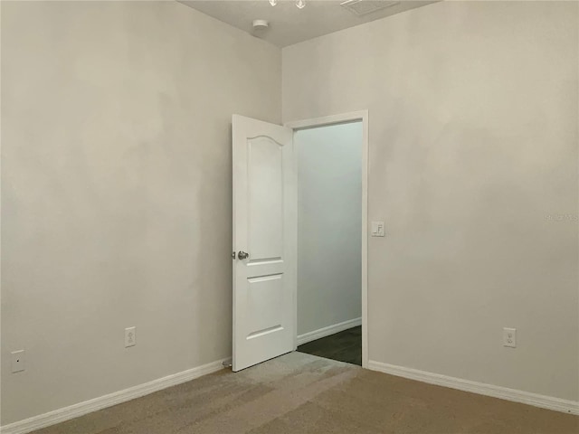 unfurnished room featuring carpet floors