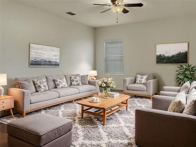 living room with ceiling fan and wood-type flooring