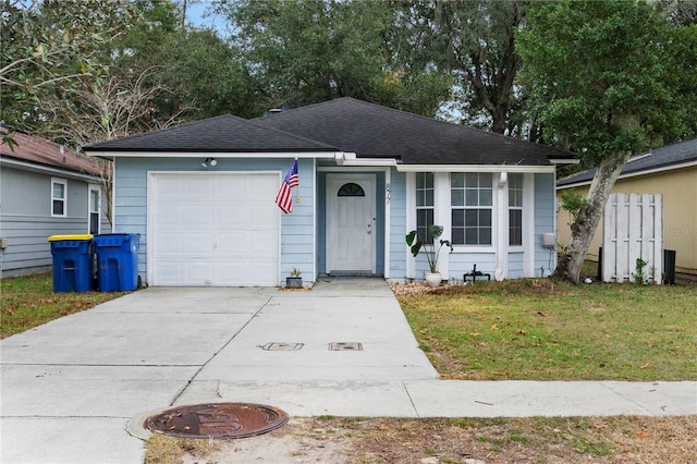 ranch-style home with a front lawn and a garage