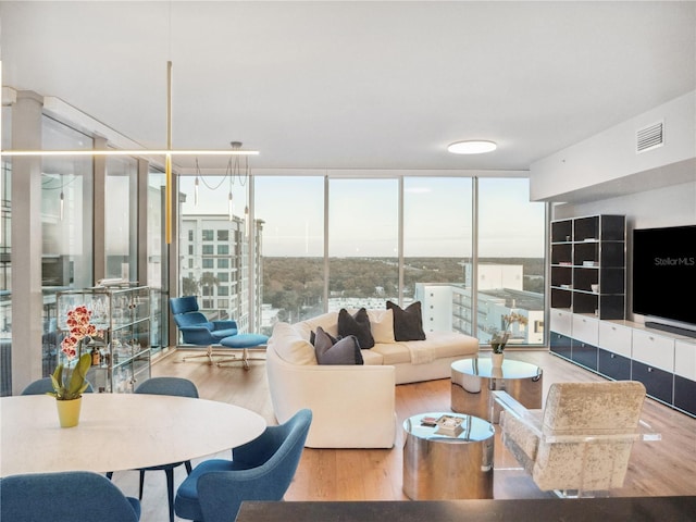 living room featuring hardwood / wood-style flooring and floor to ceiling windows