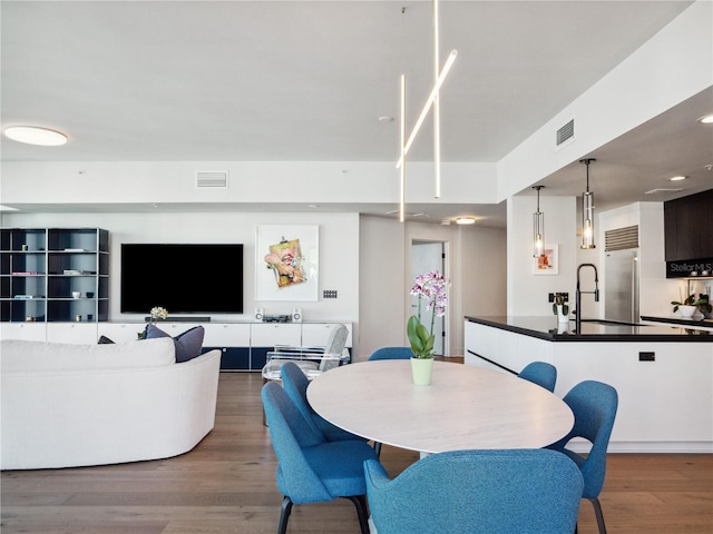 dining area with dark hardwood / wood-style floors