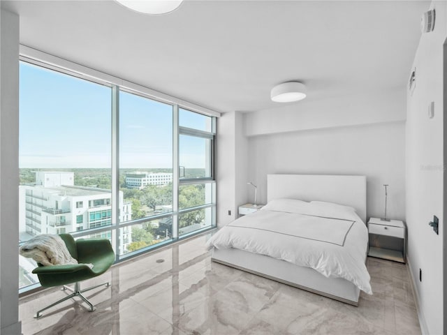 bedroom featuring a wall of windows