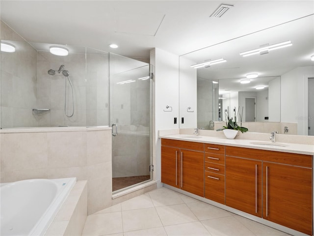 bathroom featuring tile patterned flooring, vanity, and independent shower and bath