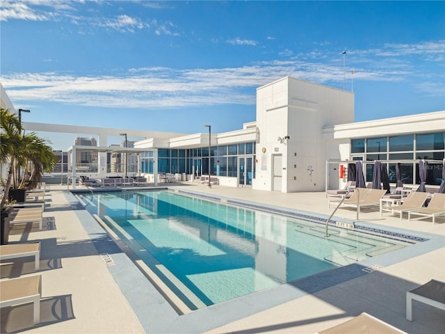 view of pool featuring a patio