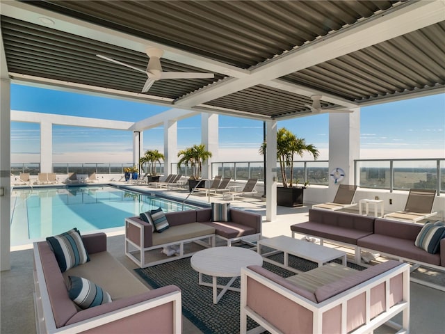 view of patio / terrace featuring ceiling fan, a community pool, and outdoor lounge area