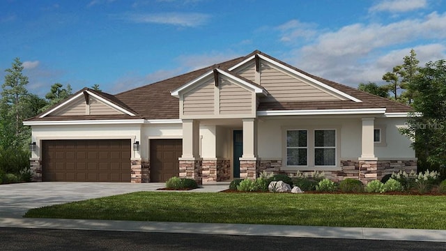 view of front of home with a garage and a front yard