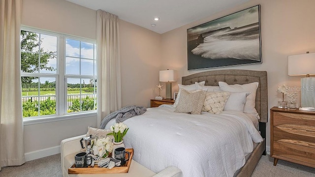 bedroom featuring light carpet