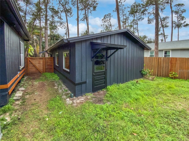 view of outdoor structure featuring a lawn