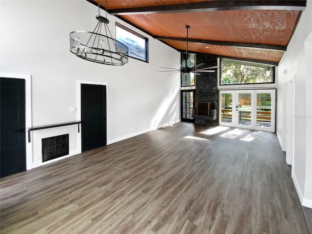 unfurnished living room with wooden ceiling, beamed ceiling, high vaulted ceiling, dark hardwood / wood-style flooring, and a stone fireplace