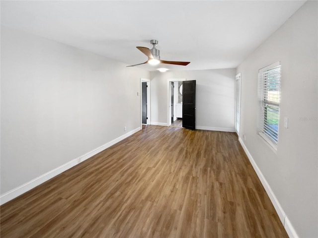 spare room with hardwood / wood-style flooring and ceiling fan