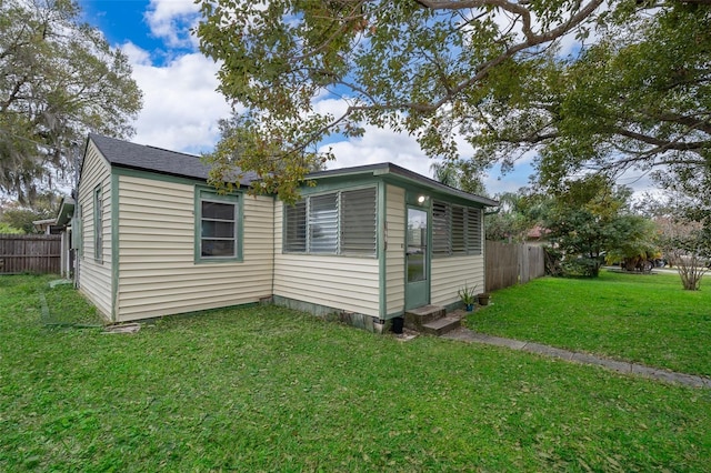 view of home's exterior featuring a yard