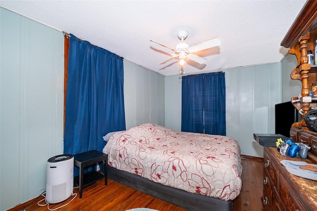 bedroom featuring dark hardwood / wood-style flooring and ceiling fan