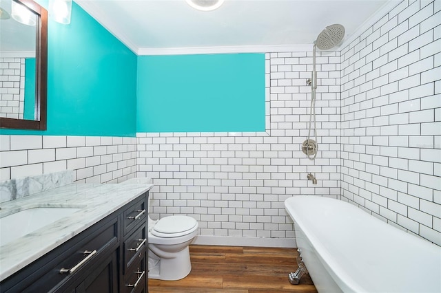 full bathroom featuring toilet, ornamental molding, tile walls, and hardwood / wood-style floors