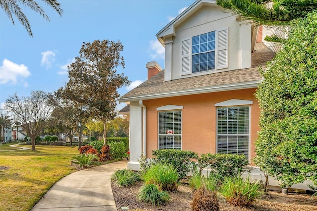 view of home's exterior featuring a lawn